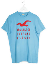 Tricou Hollister albastru deschis mărime L vedere din față second-hand premium