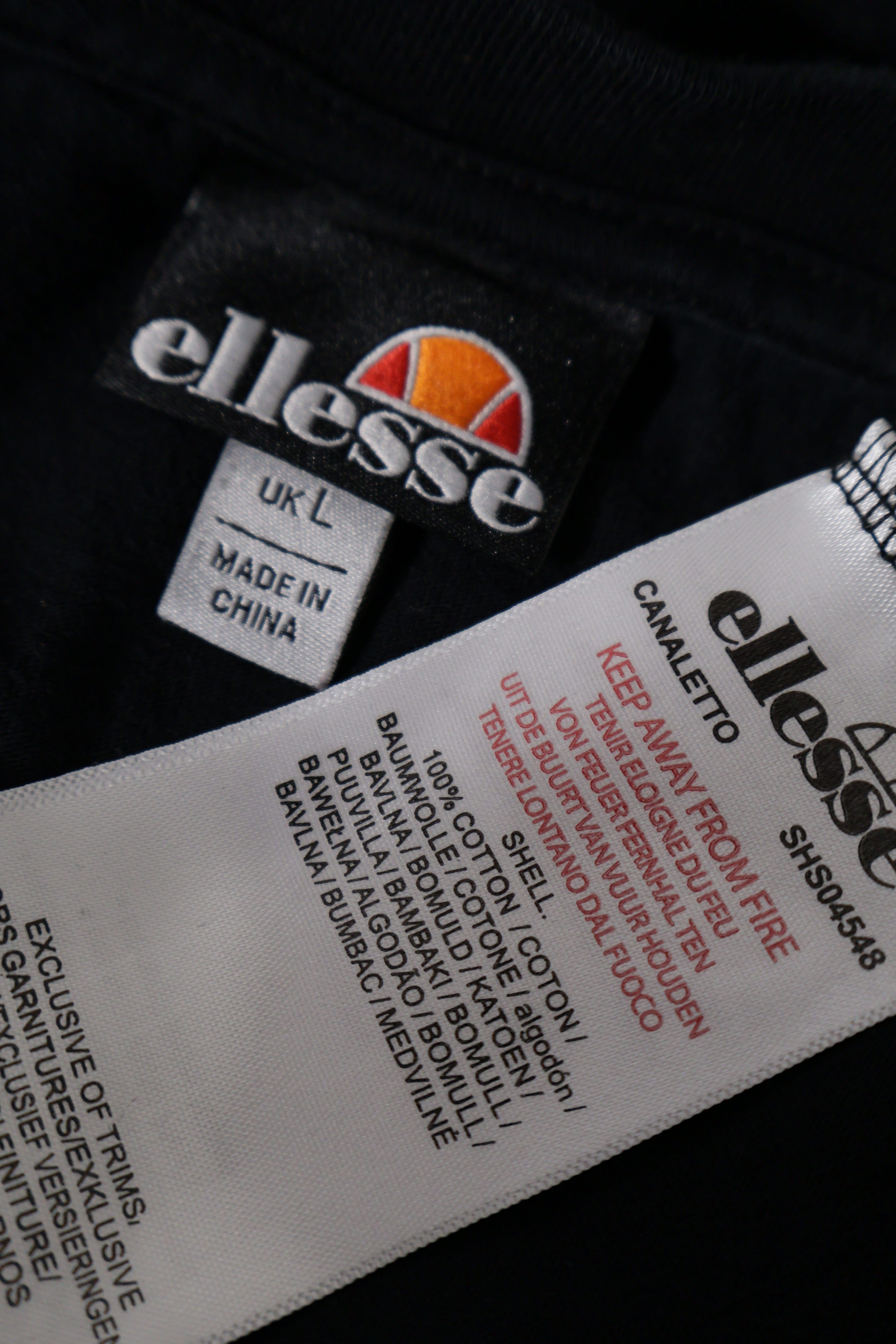 Eticheta marime si compozitie (rotita dreapta) - Tricou - Ellesse negru din bumbac cu logo la piept – L – Femei