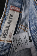 Eticheta marime si compozitie (rotita dreapta) - Blugi scurți - Levi's albaștri deschiși, rupți, cu tiv franjurat – M – Femei