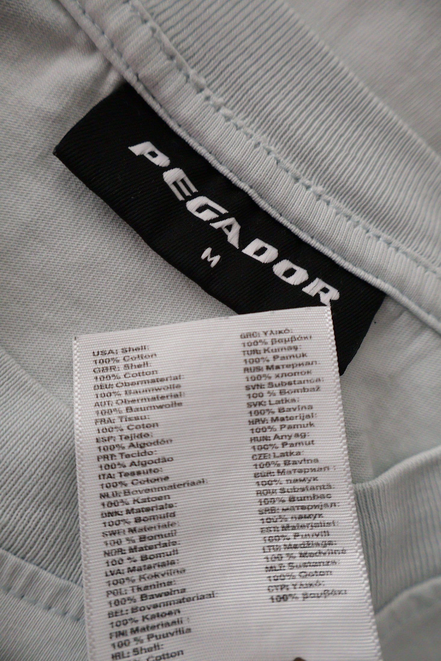 Tricou PEGADOR gri deschis mărime M etichetă mărime și compoziție second-hand premium