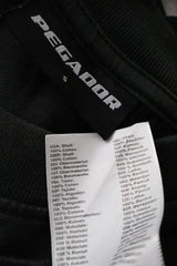 Tricou PEGADOR negru mărime S etichetă mărime și compoziție second-hand premium