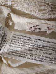 Eticheta marime si compozitie (rotita dreapta) - Top Hollister cu dantelă fină – M – Femei