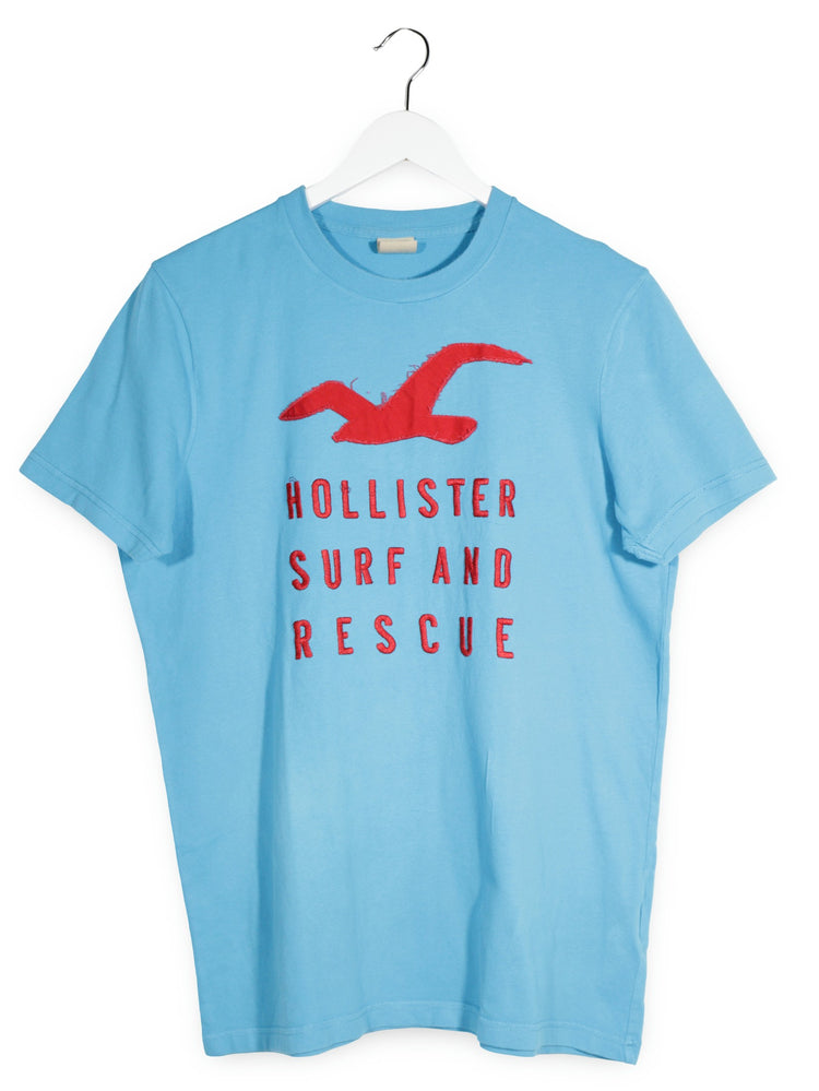 Tricou Hollister albastru deschis mărime L vedere din față second-hand premium