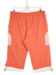 Pantaloni 2/3 PUMA portocaliu mărime XL vedere din spate second-hand premium