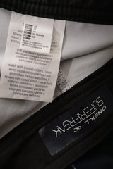 Pantaloni scurti O'Neill negru cu print albastru-verzui mărime S etichetă mărime și compoziție second-hand premium
