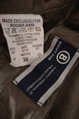 Pantaloni Bogner Jeans gri-olive metalizat mărime M etichetă mărime și compoziție second-hand premium