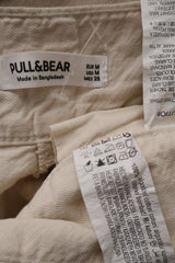 Pantaloni PULL&BEAR bej deschis mărime M etichetă mărime și compoziție second-hand premium