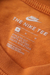 Tricou NIKE portocaliu mărime M etichetă mărime și compoziție second-hand premium