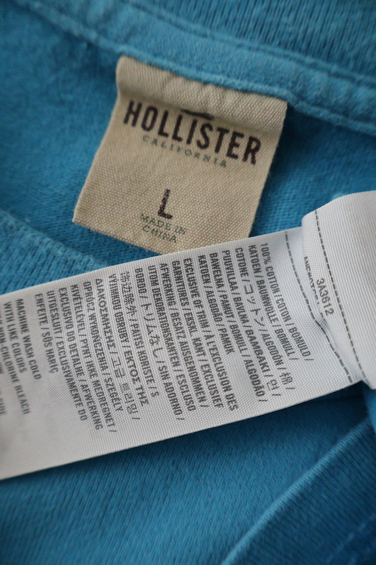 Tricou Hollister albastru deschis mărime L etichetă mărime și compoziție second-hand premium