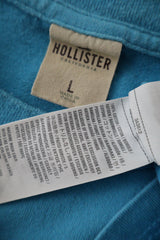 Tricou Hollister albastru deschis mărime L etichetă mărime și compoziție second-hand premium