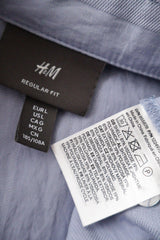 Camasa H&M albastru deschis mărime L etichetă mărime și compoziție second-hand premium