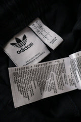 Pantaloni Adidas negru mărime L etichetă mărime și compoziție second-hand premium
